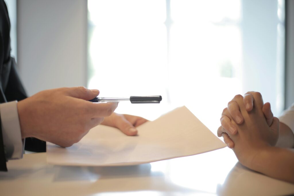 pexels photo 3760067 3760067 Close-up of a contract signing with hands over documents. Professional business interaction.